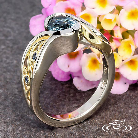 Waterfall Inspired Wrap Ring Holding A Oval Montana Sapphire