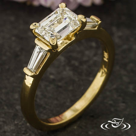 East-West Style Three Stone Emerald Cut Ring