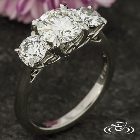 Three Stone Trellis Style Engagement Ring With A Lotus Flower