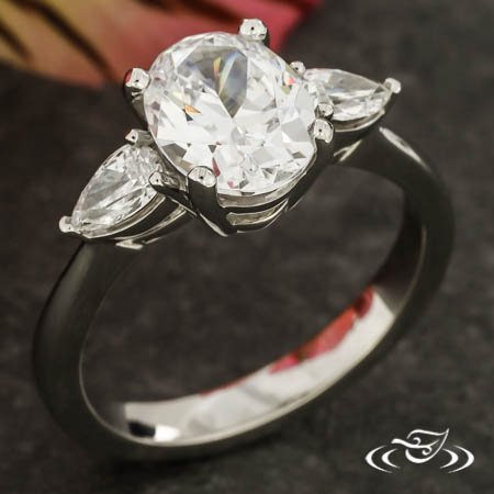Three Stone Ring With Pear Sides 