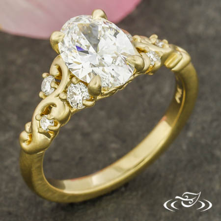 Oval Diamond Ring With A Diamond Scroll Shoulder