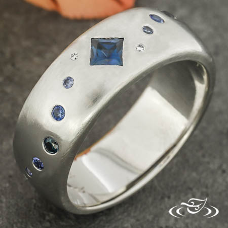 Wedding Band With Sapphire And Diamonds In A Wave Motif