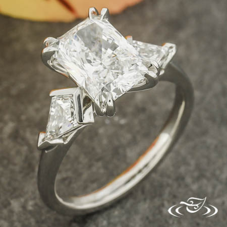 Three Stone Ring With Radiant Cut Center And Kite Shaped Side Stones