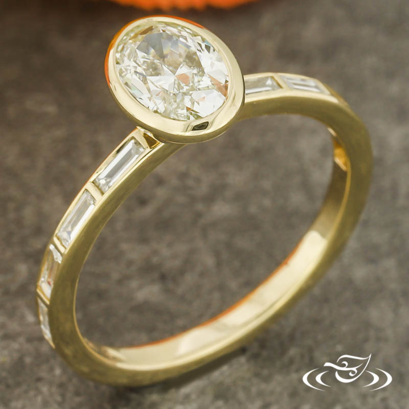 Bezel Set Oval Diamond Ring With Baguettes