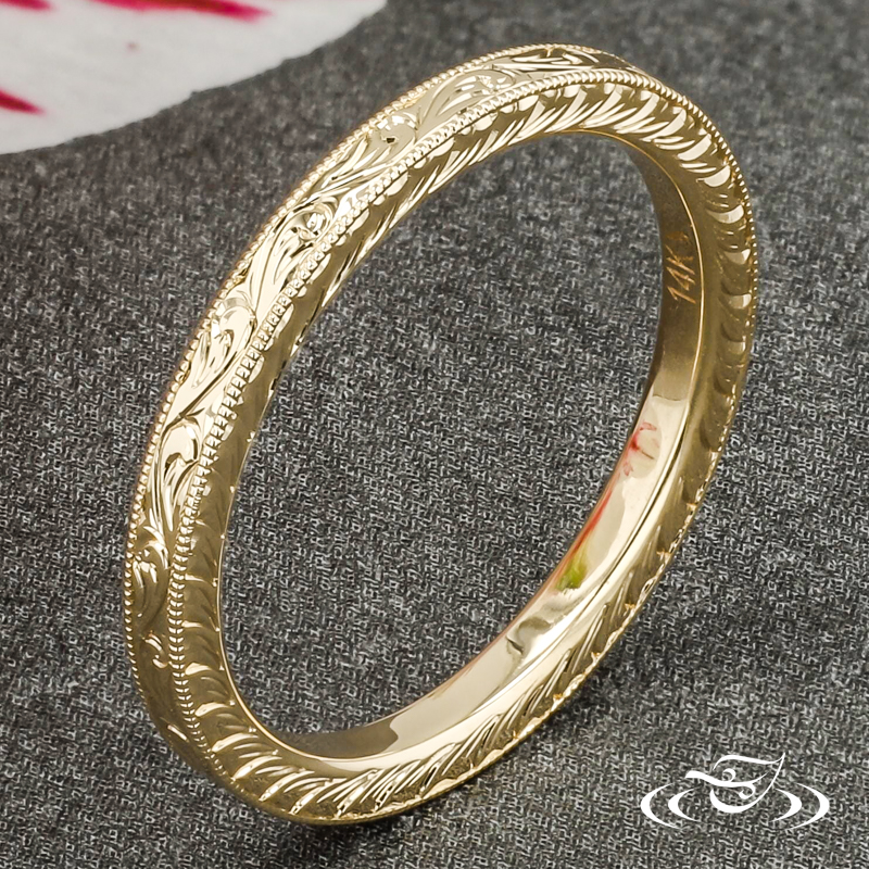 Custom Flat Comfort Fit 14K Yellow Gold Band With Hand Engraved Scroll Patterning Eternity Style Around The Top Face. Both Side Faces Are Accented By Hand Engraved Half Wheat Patterning. This Band Has Milgrain Edges And A High Polish Finish.
